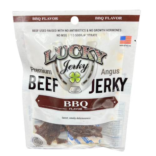 A package of Lucky Premium Jerky, Angus Beef, BBQ Flavor, with a claim of no antibiotics, no growth hormones, and no MSG. The package is white with product images and branding details.