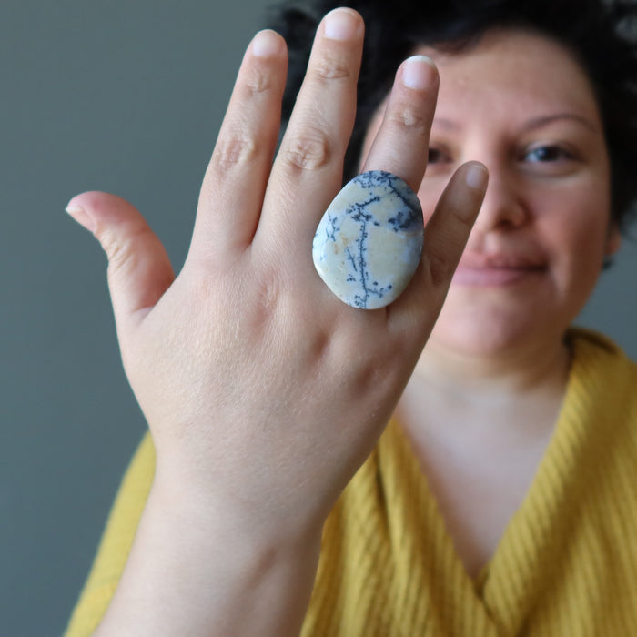 female model wearing big dendritic jasper ring