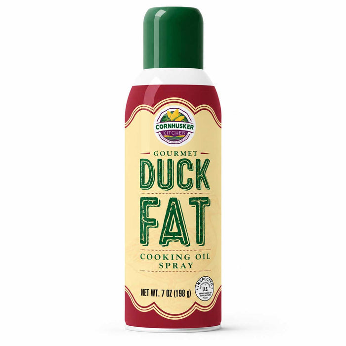 A 7 oz aerosol can of Cornhusker Kitchen Gourmet Duck Fat Cooking Oil Spray, featuring a cream-colored label with green lettering and a dark green cap, set against a plain white background.