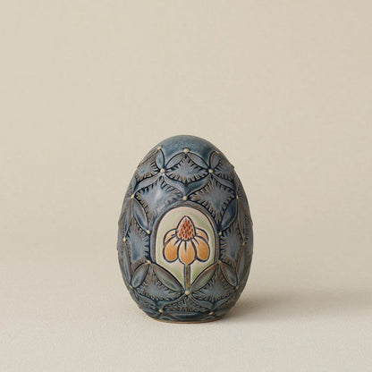 Handcrafted ceramic egg by Rookwood Pottery