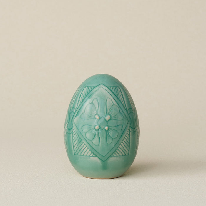 Handcrafted ceramic egg by Rookwood Pottery