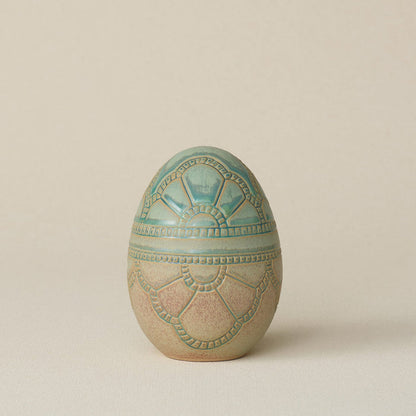 Handcrafted ceramic egg by Rookwood Pottery