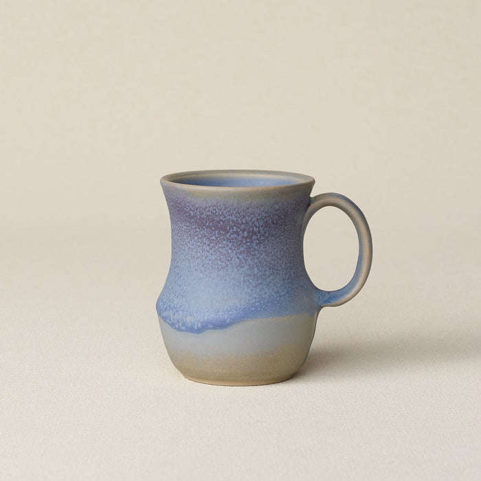 Hand-thrown ceramic mug by Rookwood Pottery