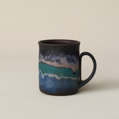 Hand-thrown ceramic mug by Rookwood Pottery