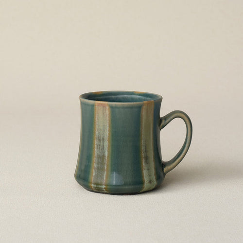 Hand-thrown ceramic mug by Rookwood Pottery