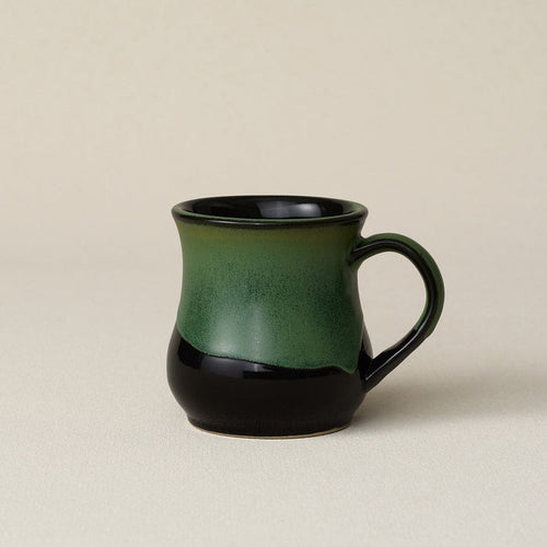 Hand-thrown ceramic mug by Rookwood Pottery