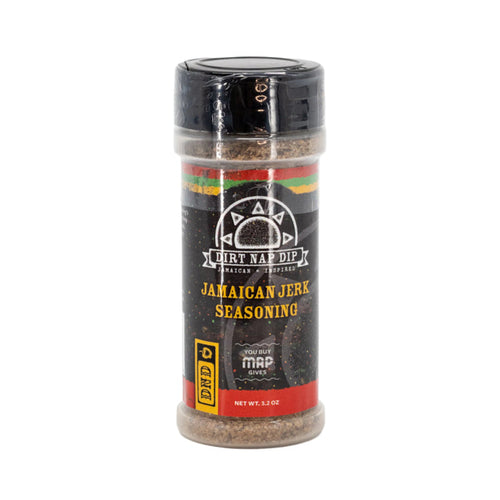 A bottle of Jamaican Jerk Seasoning by Mystic Rhoads Productions, 3.2 oz size, with a black cap and label featuring red and yellow stripes.