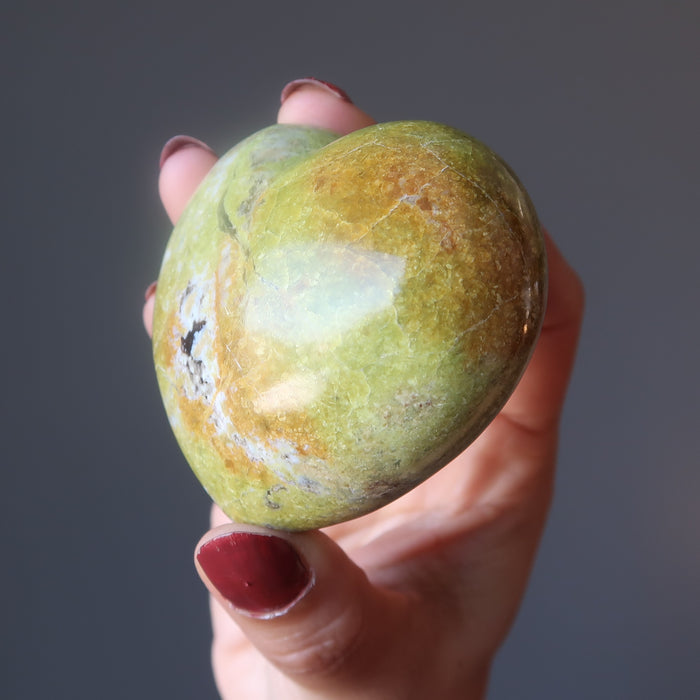 hand holding Green Opal Heart