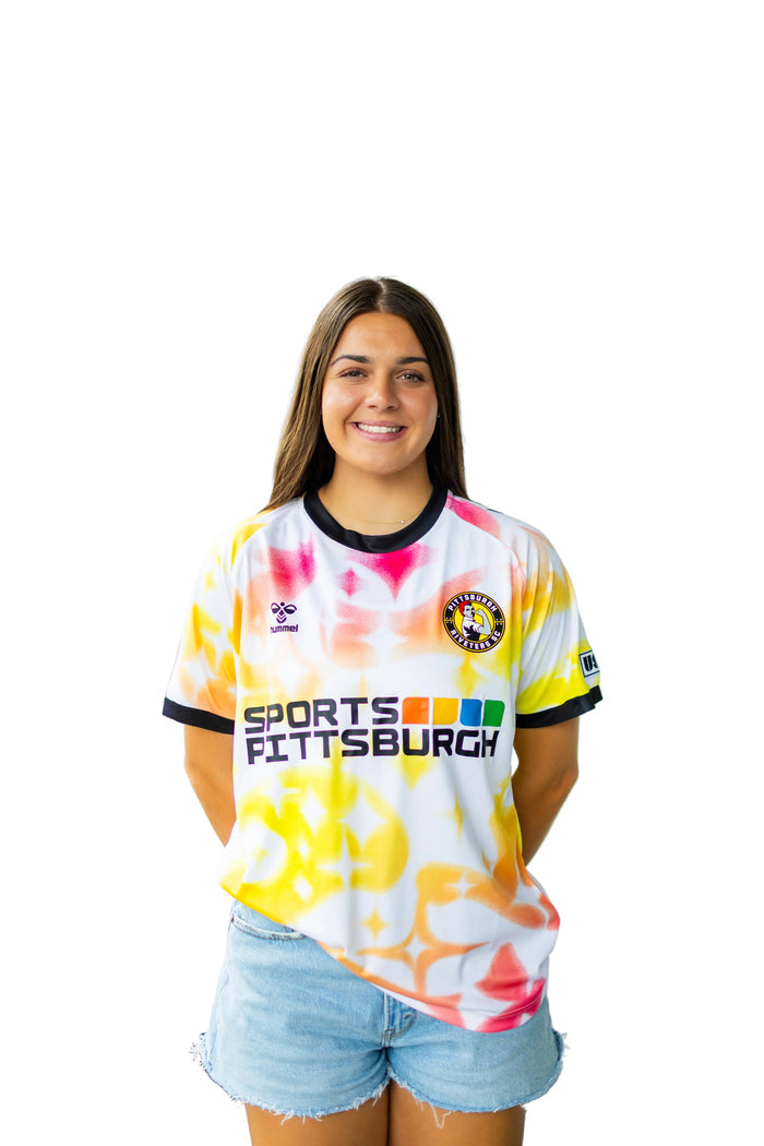 Woman wearing a colorful Pittsburgh Riveters jersey with 'Sports Pittsburgh' text on a white background