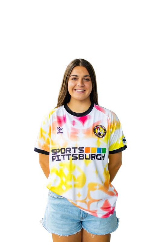 Woman wearing a colorful Pittsburgh Riveters jersey with 'Sports Pittsburgh' text on a white background